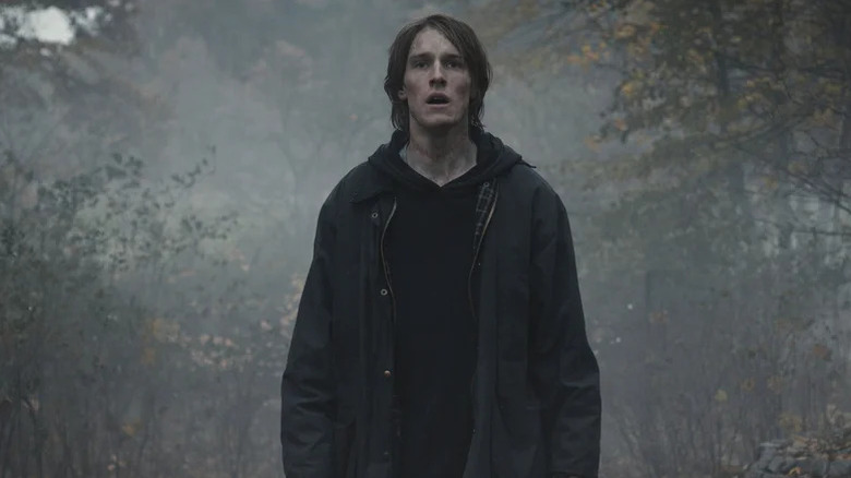 Jonas Kahnwald (Louis Hofman) stands with his mouth agape in a misty forest in Dark
