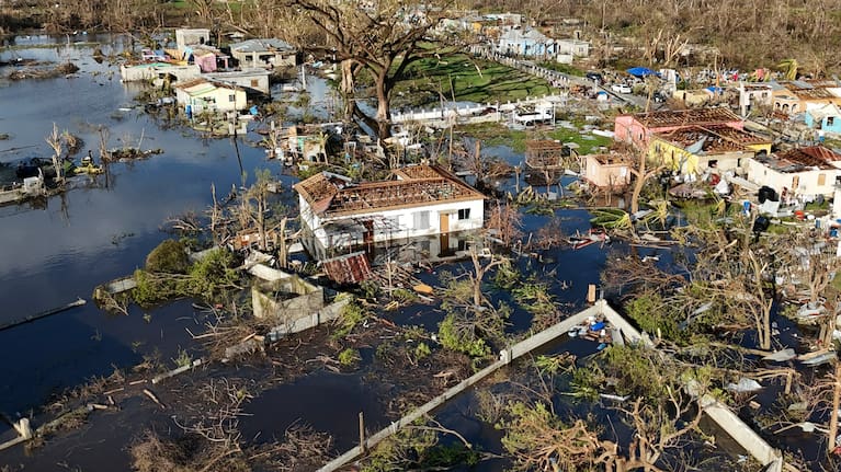 Debris surrounds damaged homes along the Black River, Jamaica.