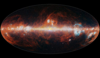 In a dark oval, the bright band of the milky way runs horizontally, surrounded by wild plumes of red and orange gas.