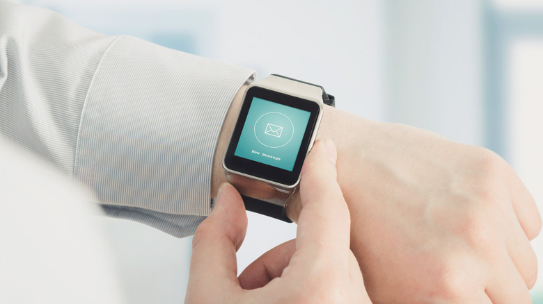 A smartwatch with email icon on the screen