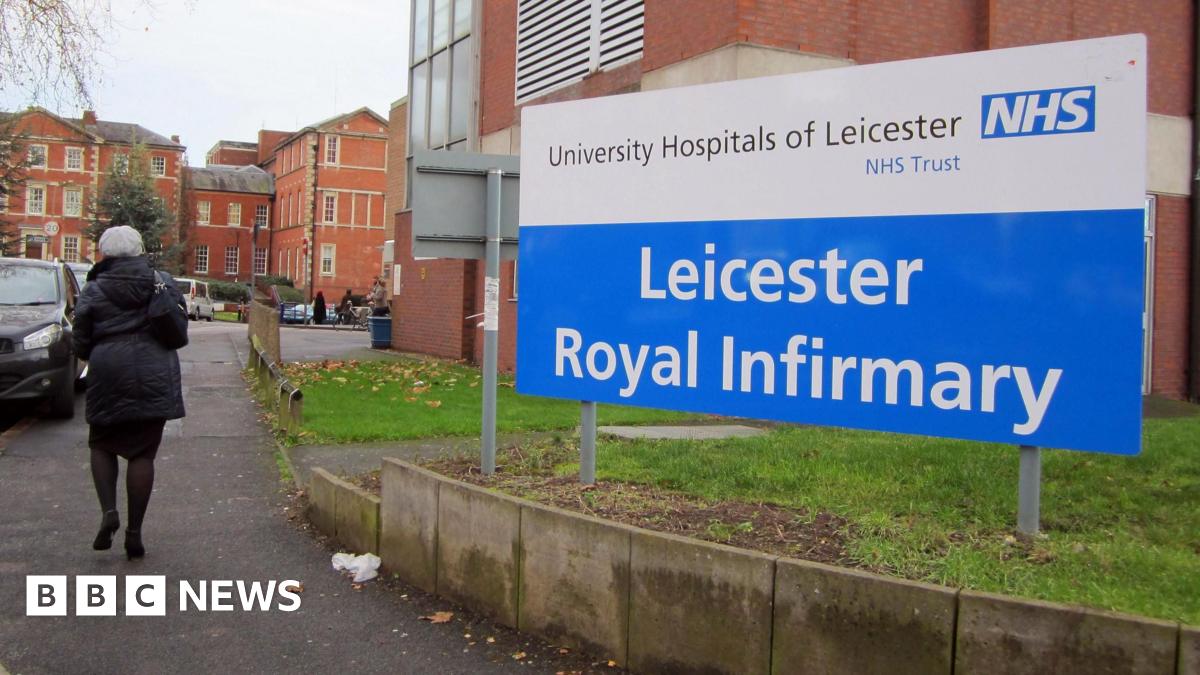 Dr Sanjeev Pattni, a consultant Gastroenterologist and co-head of service at Leicestershire's Hospitals, showing a nurse the endoscopy equipment in a medical room.