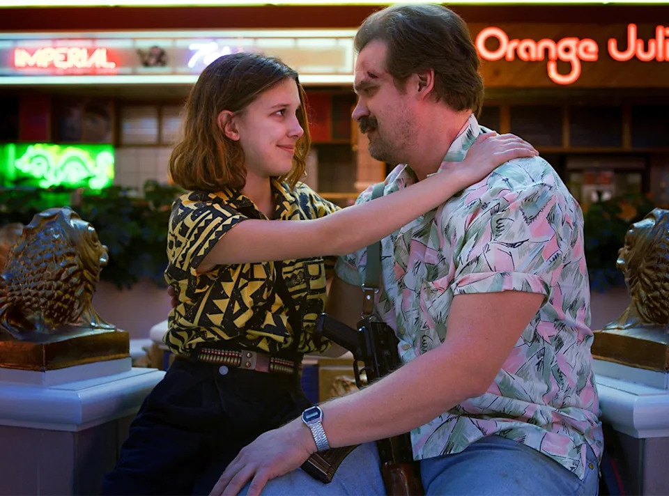 <p>13. Many fans theorized that Eleven could be Hopper's daughter, though he eventually became her surrogate father. And in a sweet Easter egg, Eleven was seen wearing the blue braided bracelet Hopper always wore, made from his late daughter's hair ribbon, at her school dance in the season two finale. </p>