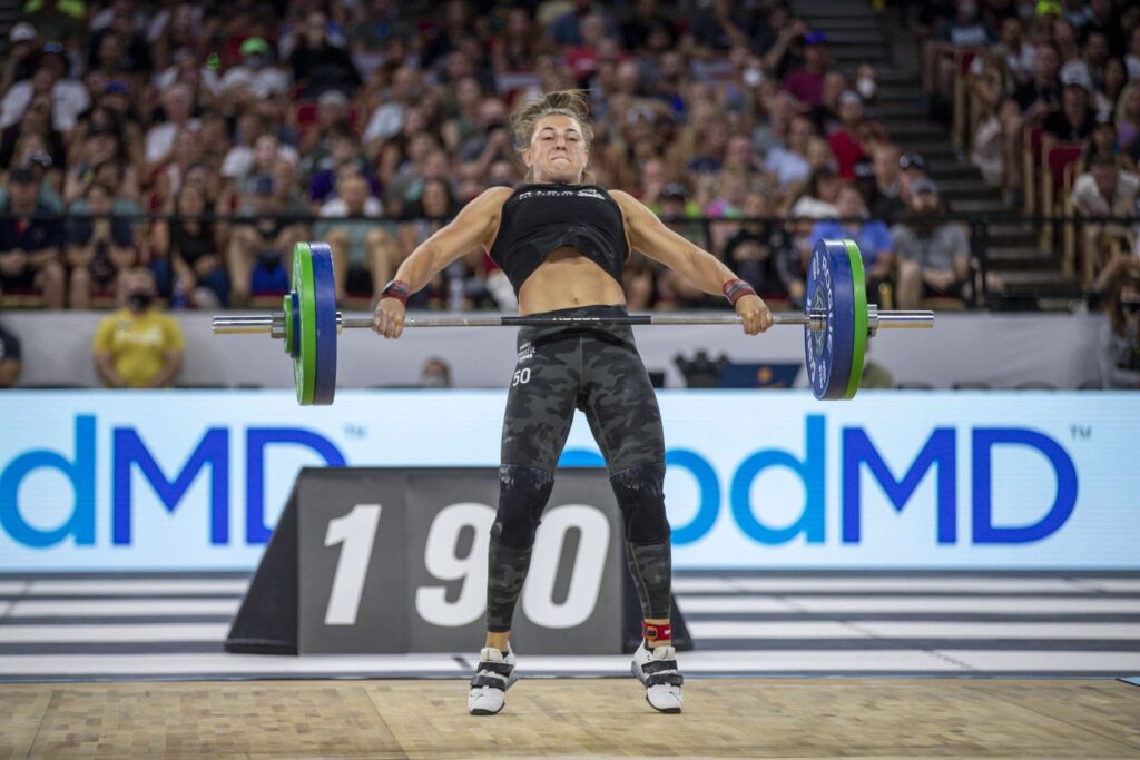 gabi migala performs a heavy snatch in weightlifting shoes