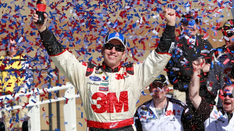 Greg Biffle celebrates in victory lane after winning the NASCAR Sprint Cup Series auto race at Kansas Speedway in 2010.