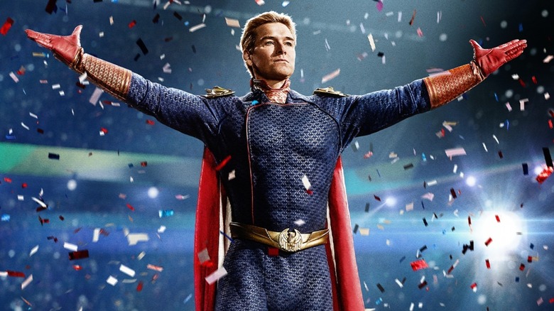 Homelander (Antony Starr) stands with his arms outstretched as confetti falls around him in The Boys