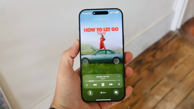 iOS 26's Lock Screen with Apple Music animated cover