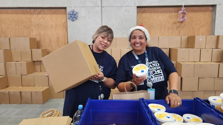 Leanne (left) and Alana from Auckland City Mission's HR department were bringing the festive spirit.