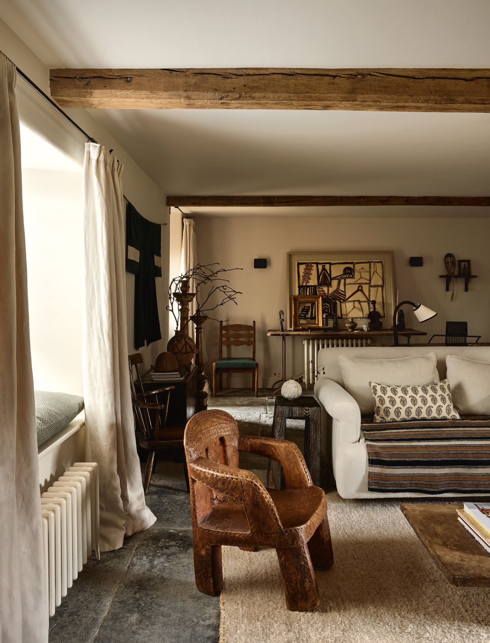 The paredback yet irresistibly cosy living area of James Thurstan Waterworth and Scarlett Supples Wiltshire farmhouse.