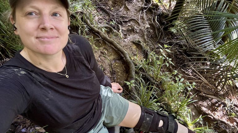 Walking with a knee brace after a ligament tear.