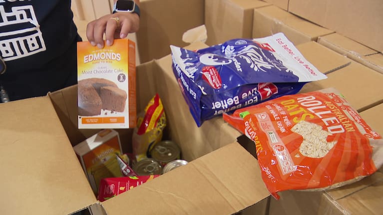 Some of the items available in this year's food parcel, before other selections are made by each family at the other stations.