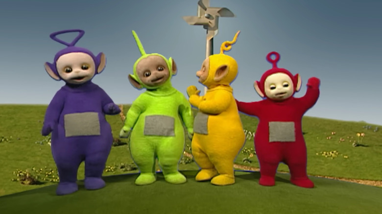 Tinky Winky, Dipsy, Laa-Laa, and Po emerge from their home in the opening of Teletubbies