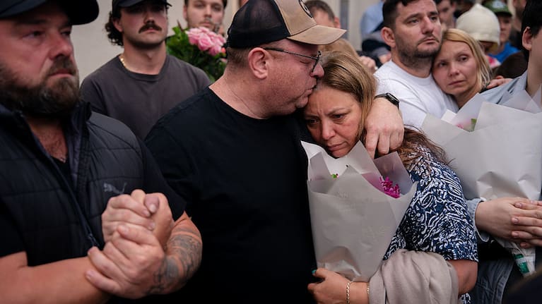  The parents of shooting victim, 10-year-old Matilda, seen during a candlelight vigil at Bondi Pavilion at Bondi Beach.