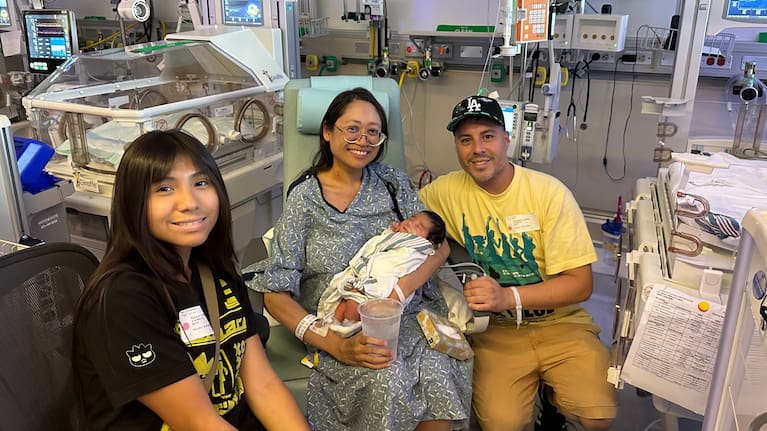 This photo provided by the family shows, from left, Kaila, Suze, Ryu and Andrew Lopez at Cedars-Sinai hospital in Los Angeles