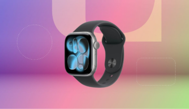 Apple Watch 11 with an aluminum face and black band against purple, pink and green CNET background.
