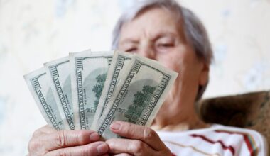 A retired senior citizen counting her cash.