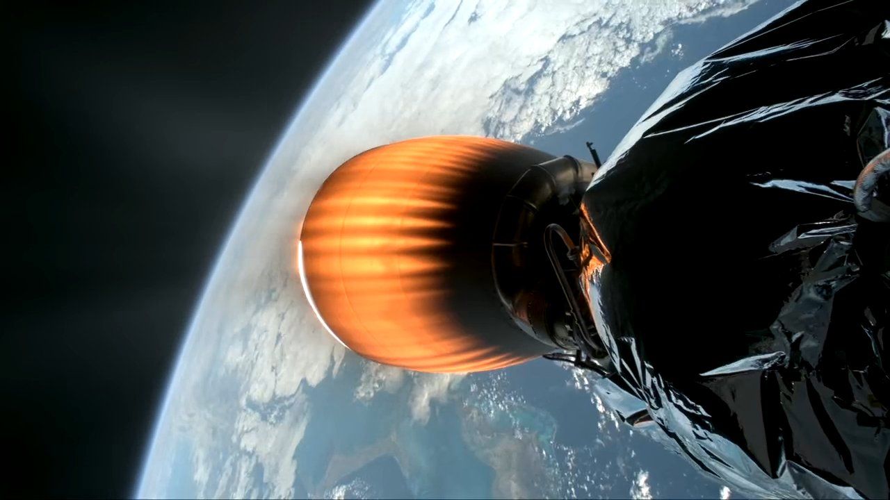 A close up of SpaceX's Falcon 9 rocket from space, showing its glowing tail floating above Earth