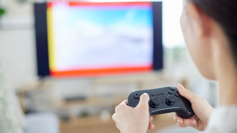 Woman plays a console game 