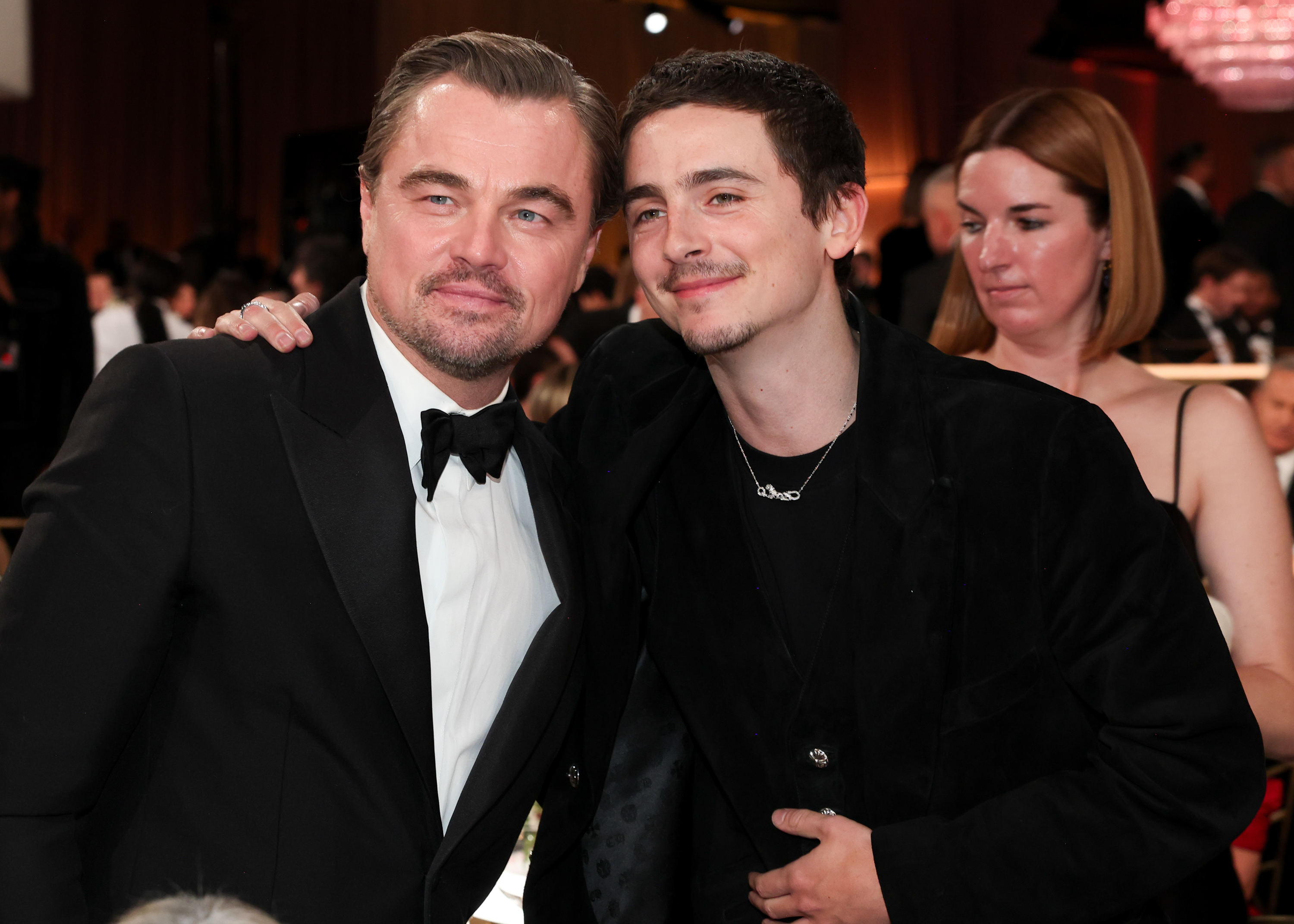 Leonardo DiCaprio and Timothée Chalamet posing together at the 83rd Annual Golden Globes.