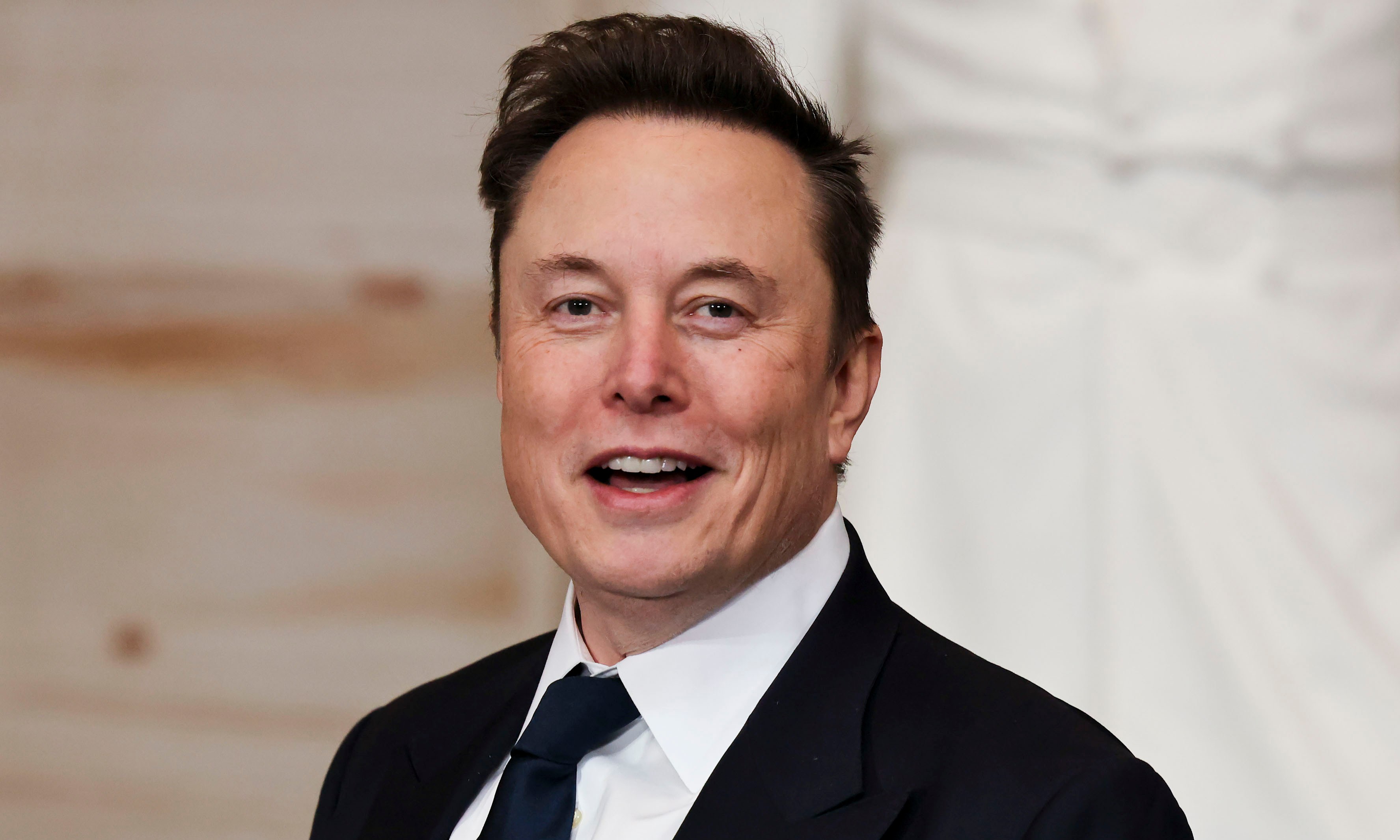 Elon Musk smiling during the 60th presidential inauguration in the US Capitol.