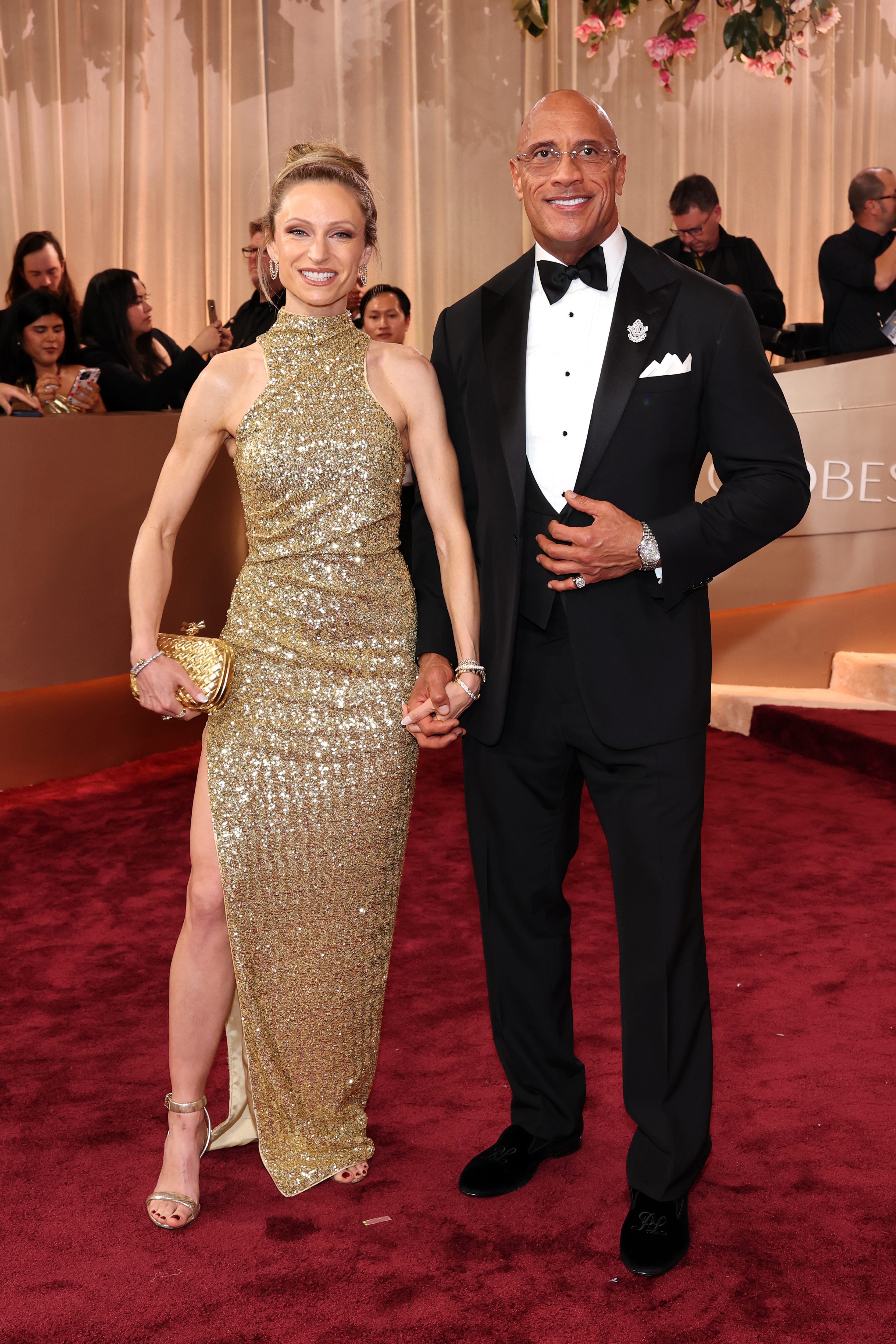 Lauren Hashian and Dwayne Johnson on the red carpet at the Golden Globe Awards.