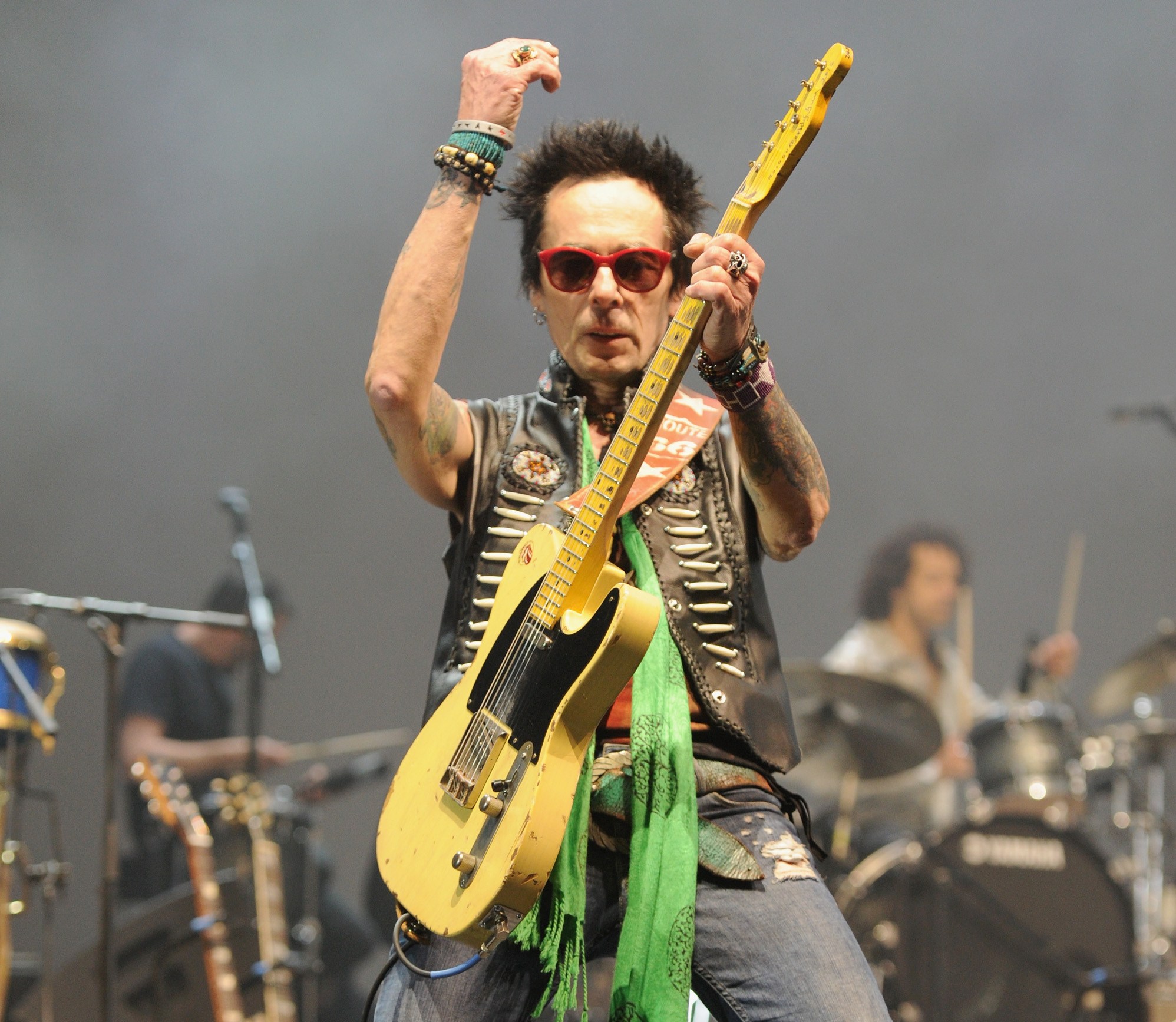 Earl Slick playing guitar on stage during the Celebrating David Bowie With Gary Oldman & Friends concert.