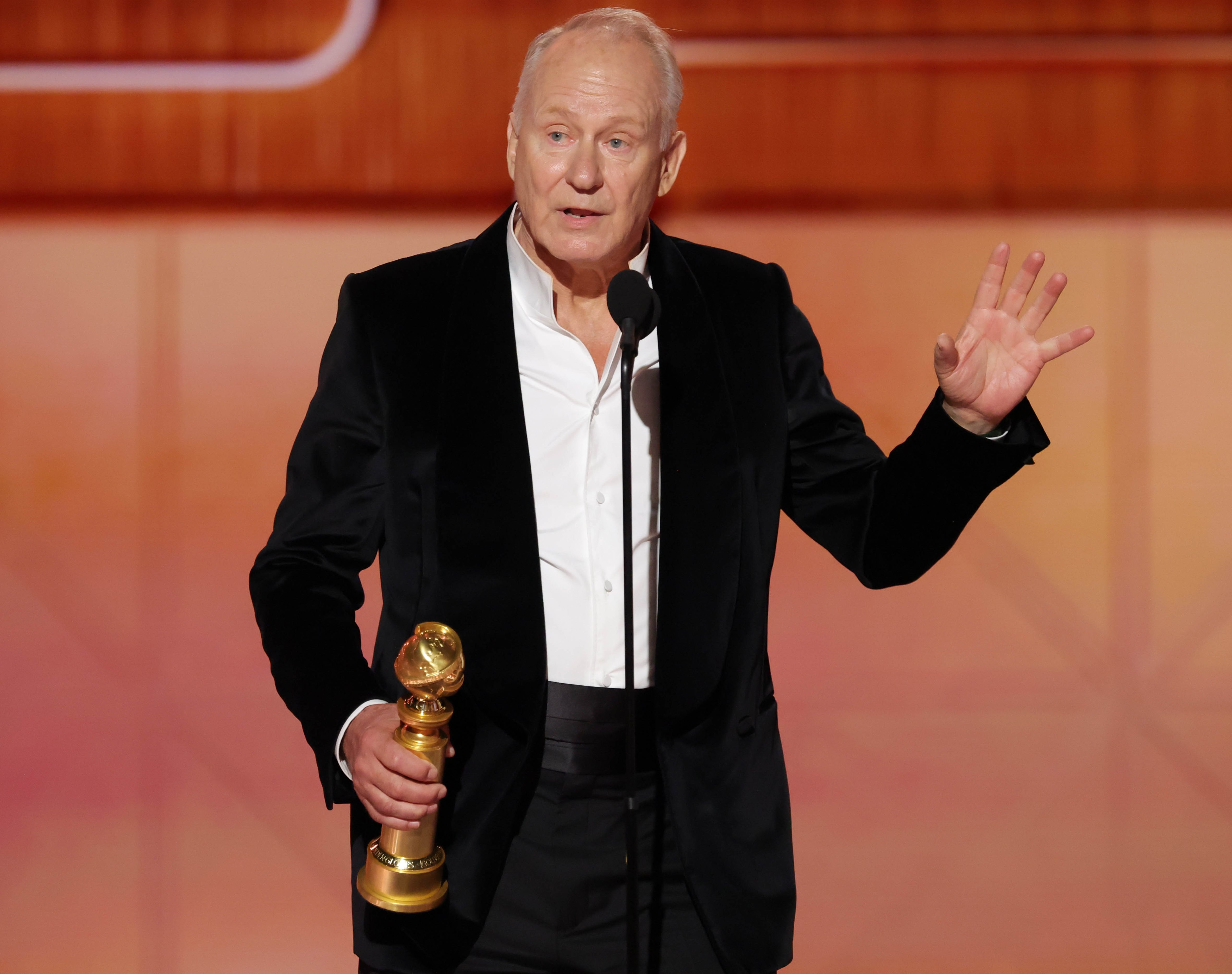 Stellan Skarsgård holding his award and speaking at the 83rd Annual Golden Globes.