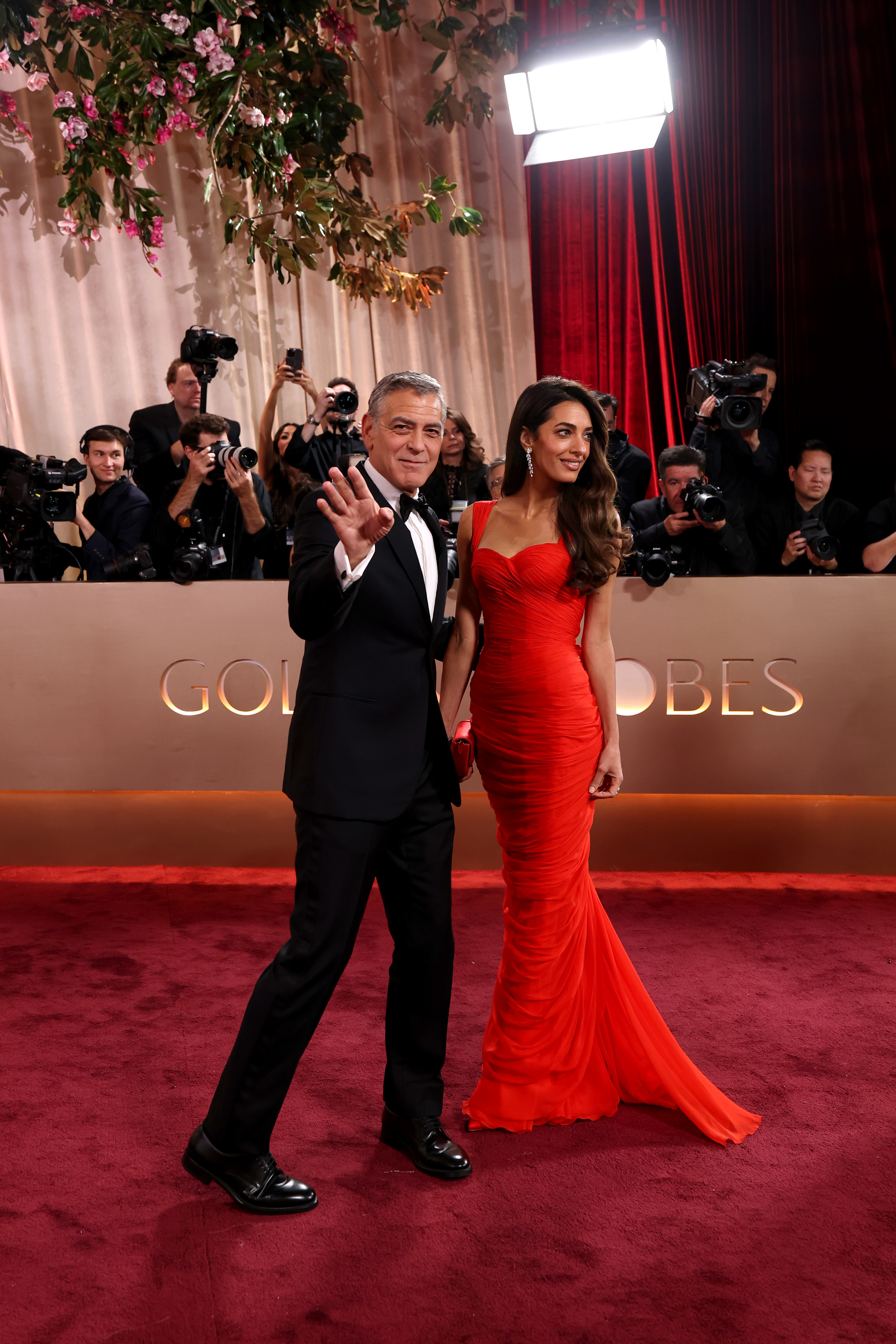 George Clooney and Amal Clooney arrive at the 83rd annual Golden Globe Awards.