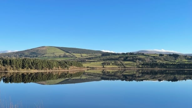 Reflection of low hills over Poulaphouca Reservoir / Blessington Lake in Co. Wicklow 