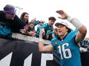 Trevor Lawrence of the Jacksonville Jaguars celebrates defeating the Tennessee Titans at EverBank Stadium.