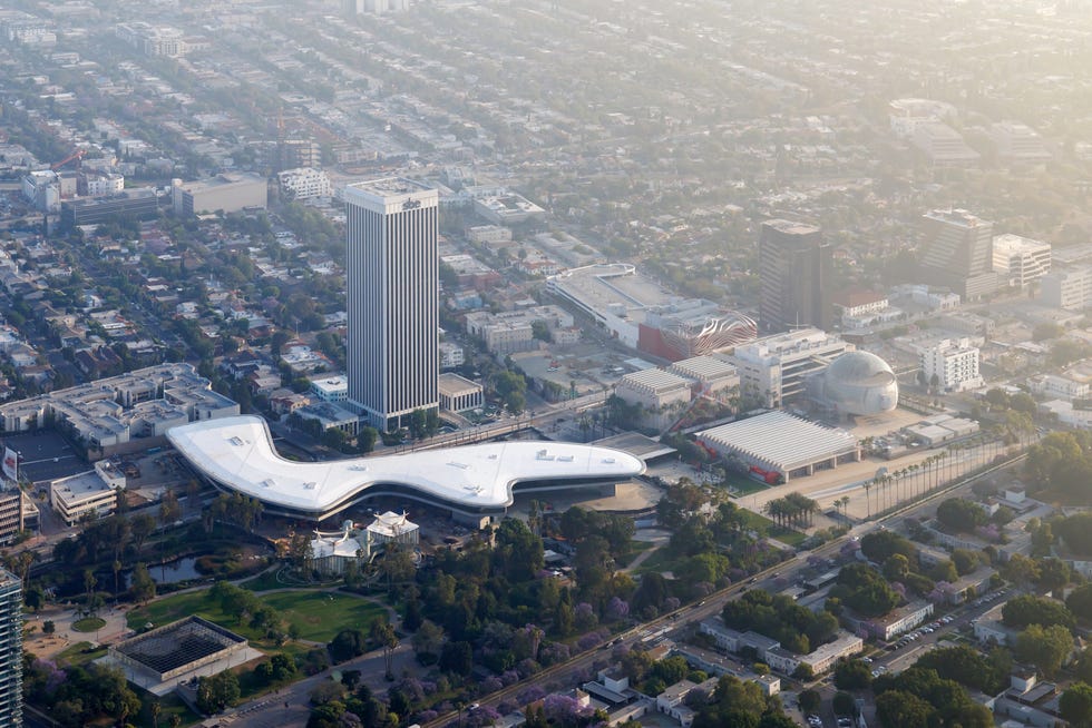 Aerial view of an urban area featuring modern architecture and greenery. Aerial view of an urban area featuring modern architecture and greenery.