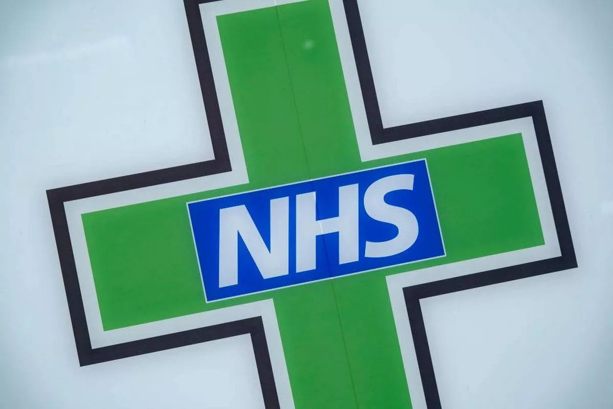 Sign for the NHS National Health Service outside a pharmacy