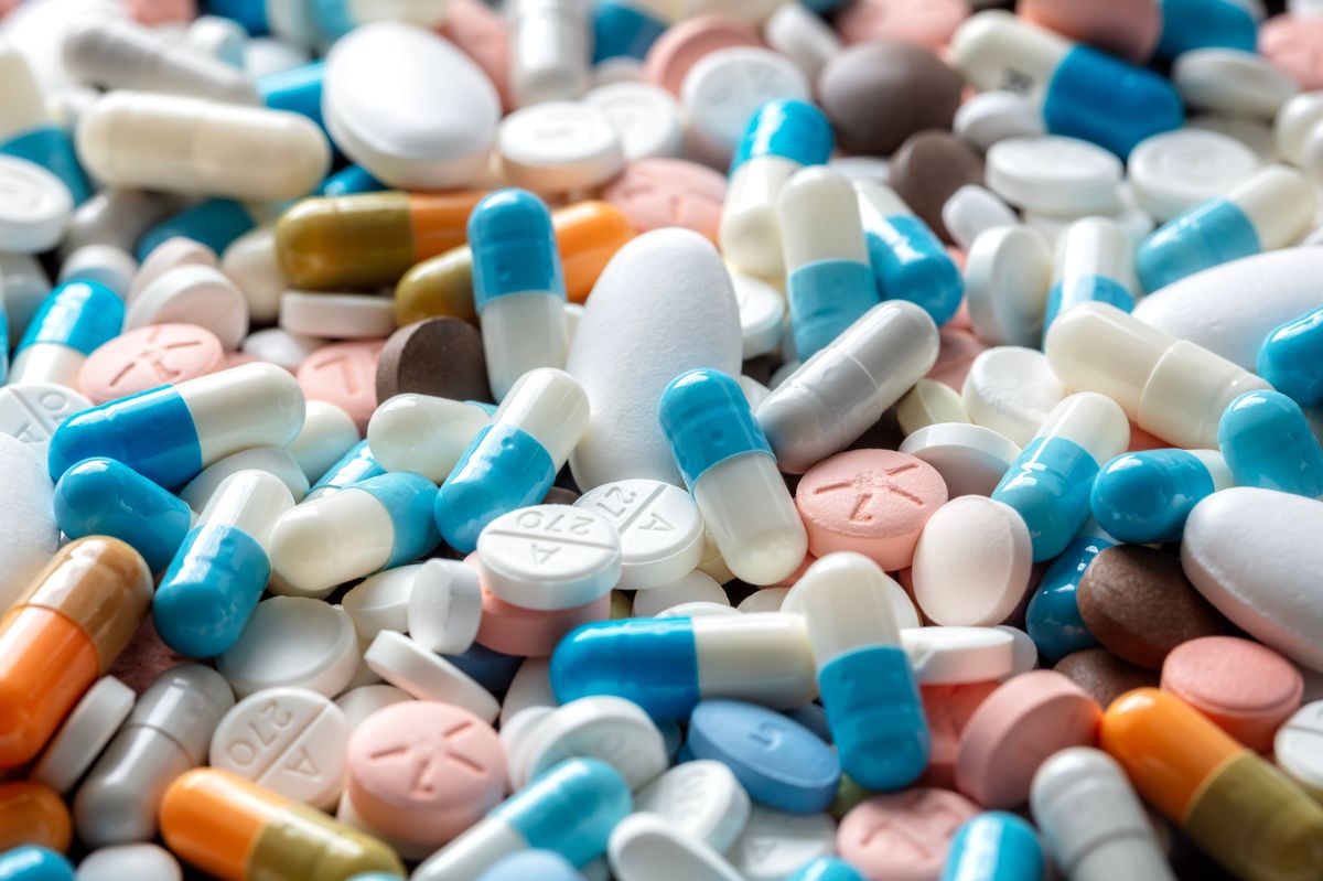 Pills tablets and capsules health care and prescription medicine close up background