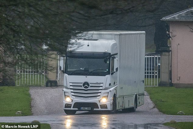 A household removal van trundles through the gates of 30-room Royal Lodge on the Windsor Estate