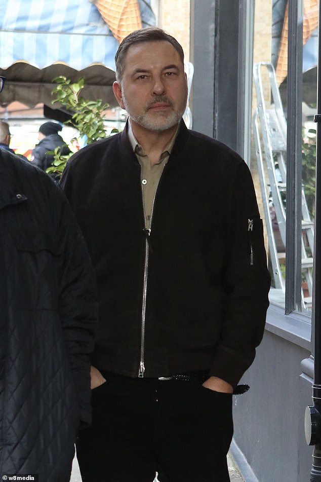 David Walliams looked downcast as he arrived at a children's event promising 'plenty of Walliams-style mischief' in his first public appearance since his fall from grace last month