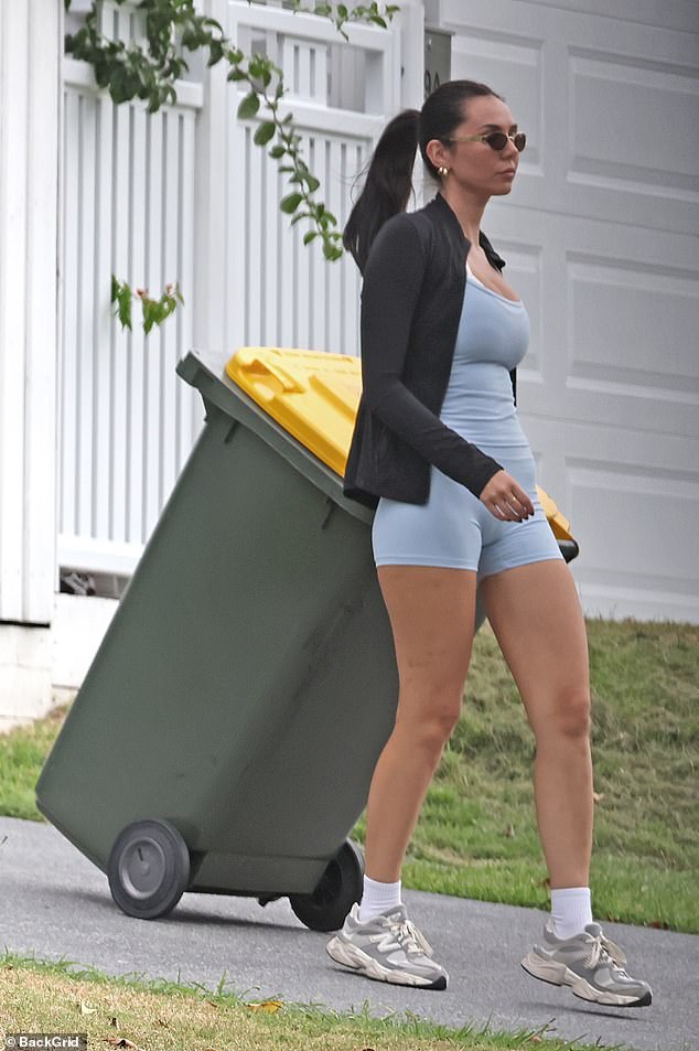Tess Crosley was spotted taking out the bins at her marital home on Monday - just a day after her husband Ben told a Daily Mail reporter that she no longer lived there