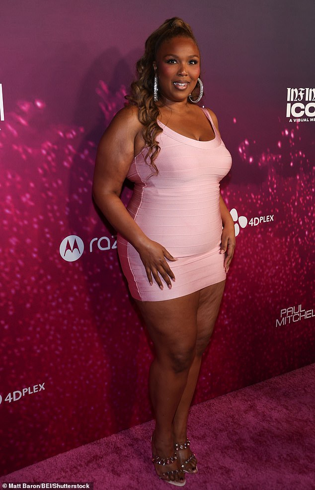 She was on-theme for Paris's pink premiere with a magenta 'red' carpet at the AMC The Grove 14 in Los Angeles
