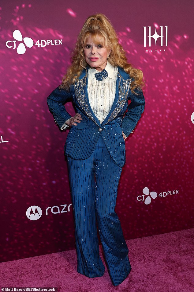 Charo, 75, looked fabulous as she posed on the red carpet in a bedazzled, royal blue suit