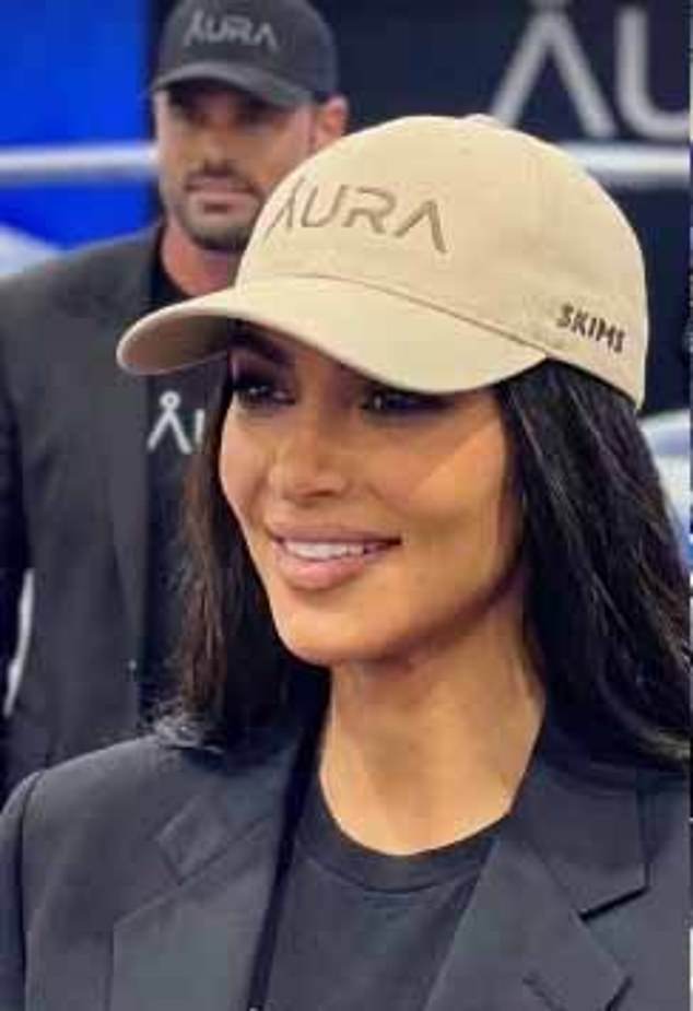 His Instagram also features an AI-generated clip of Kardashian signing some of his company's merchandise, a baseball cap