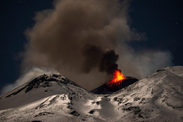 Explosive activity concentrates at the north-east crater of Mount Etna in Sicily, Italy, Dec. 29, 2025. (AP Photo/Salvatore Allegra, File)