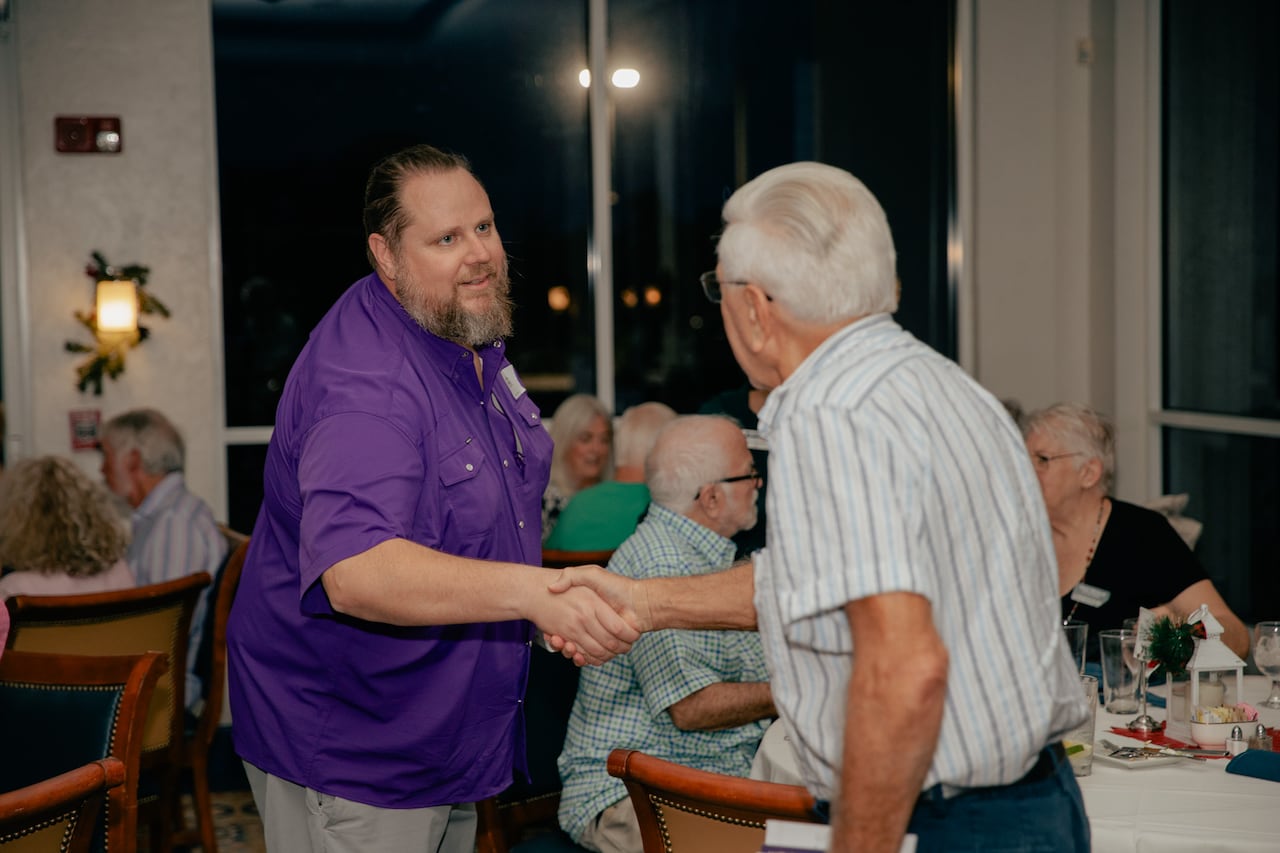 Florida Democratic congressional candidate Allen Spence shakes hand with voter in Port Charlotte, Fla.
