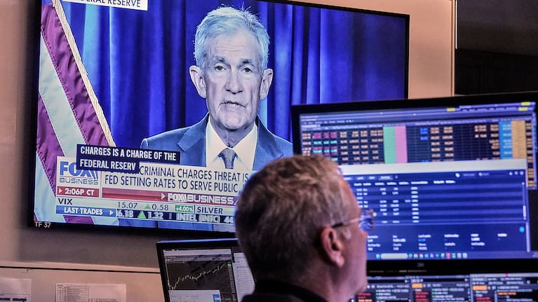 A video of Federal Reserve Chair Jerome Powell plays on a screen on the floor of the New York Stock Exchange