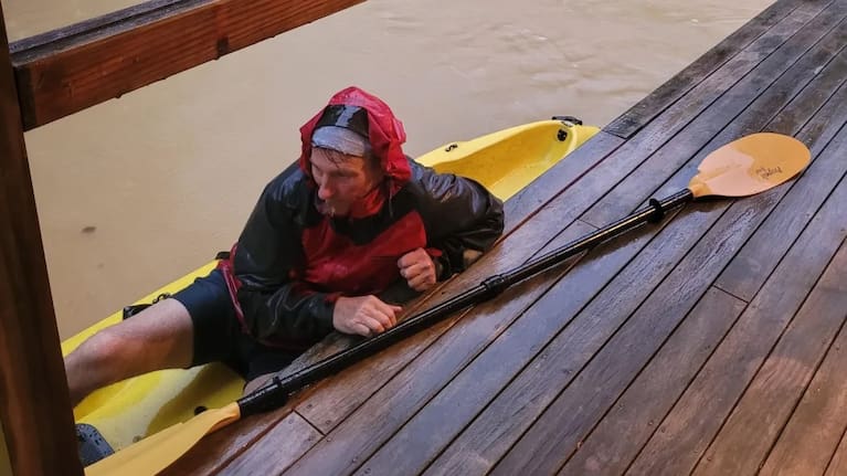 John Welch paddled through fast-flowing floodwaters to rescue his daughter and her partner from their deck of their Coromandel home.
