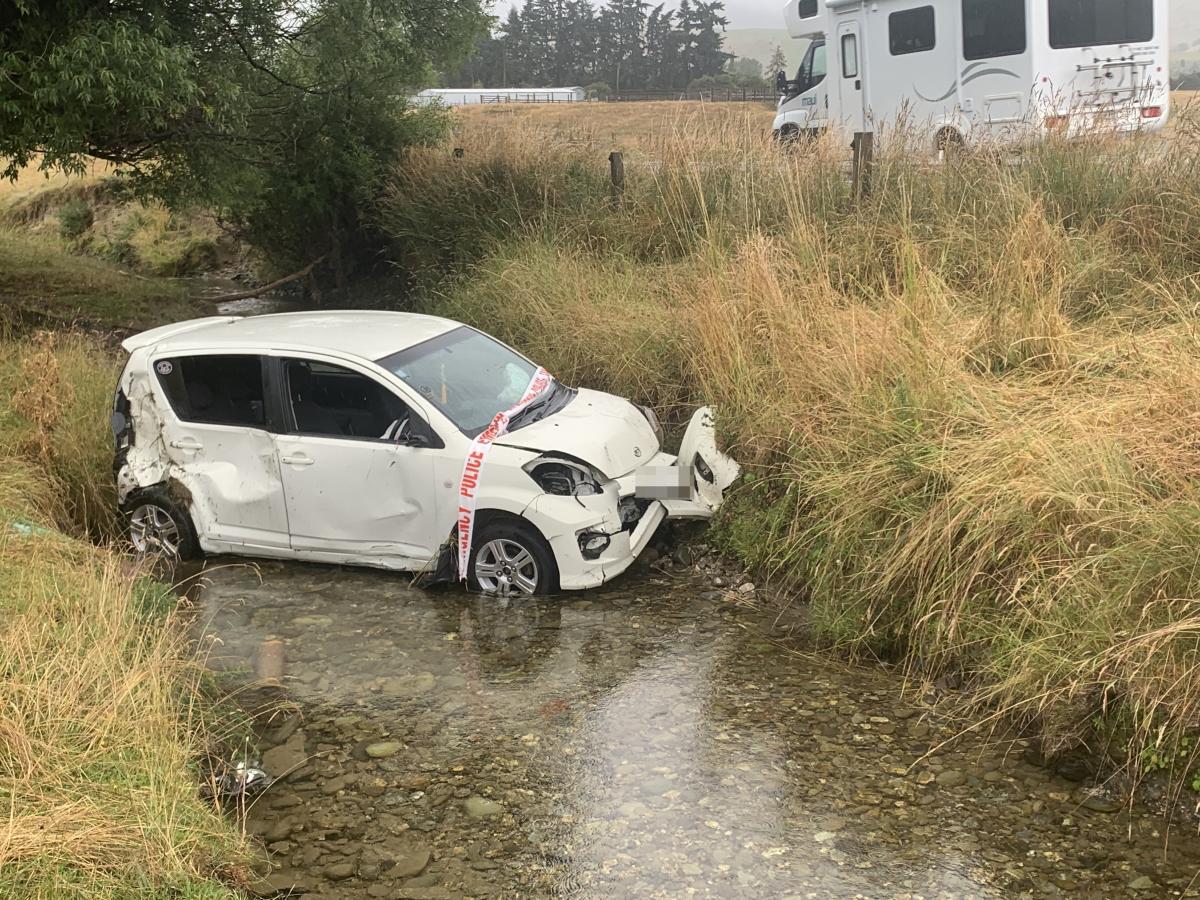 Car winds up in Southland creek