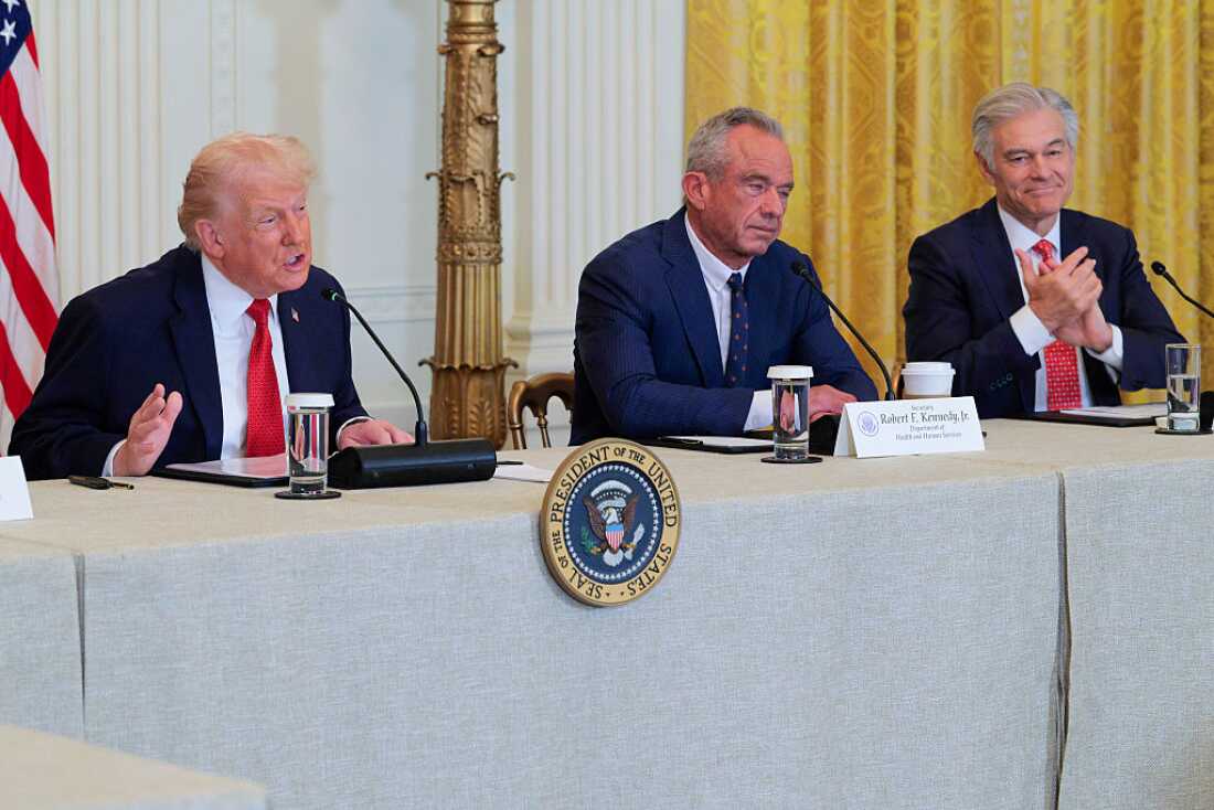 WASHINGTON, DC - JANUARY 16: (L-R) U.S. President Donald Trump speaks as U.S. Secretary of Health and Human Services Robert F. Kennedy Jr. and Administrator for the Centers for Medicare & Medicaid Services Mehmet Oz look on during a rural health roundtable on January 16, 2026 in Washington, DC.