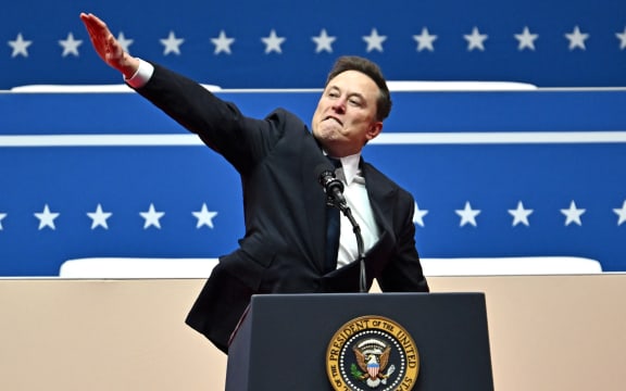 Tesla and SpaceX CEO Elon Musk gestures as he speaks during the inaugural parade inside Capitol One Arena, in Washington, DC, on January 20, 2025. (Photo by ANGELA WEISS / AFP)