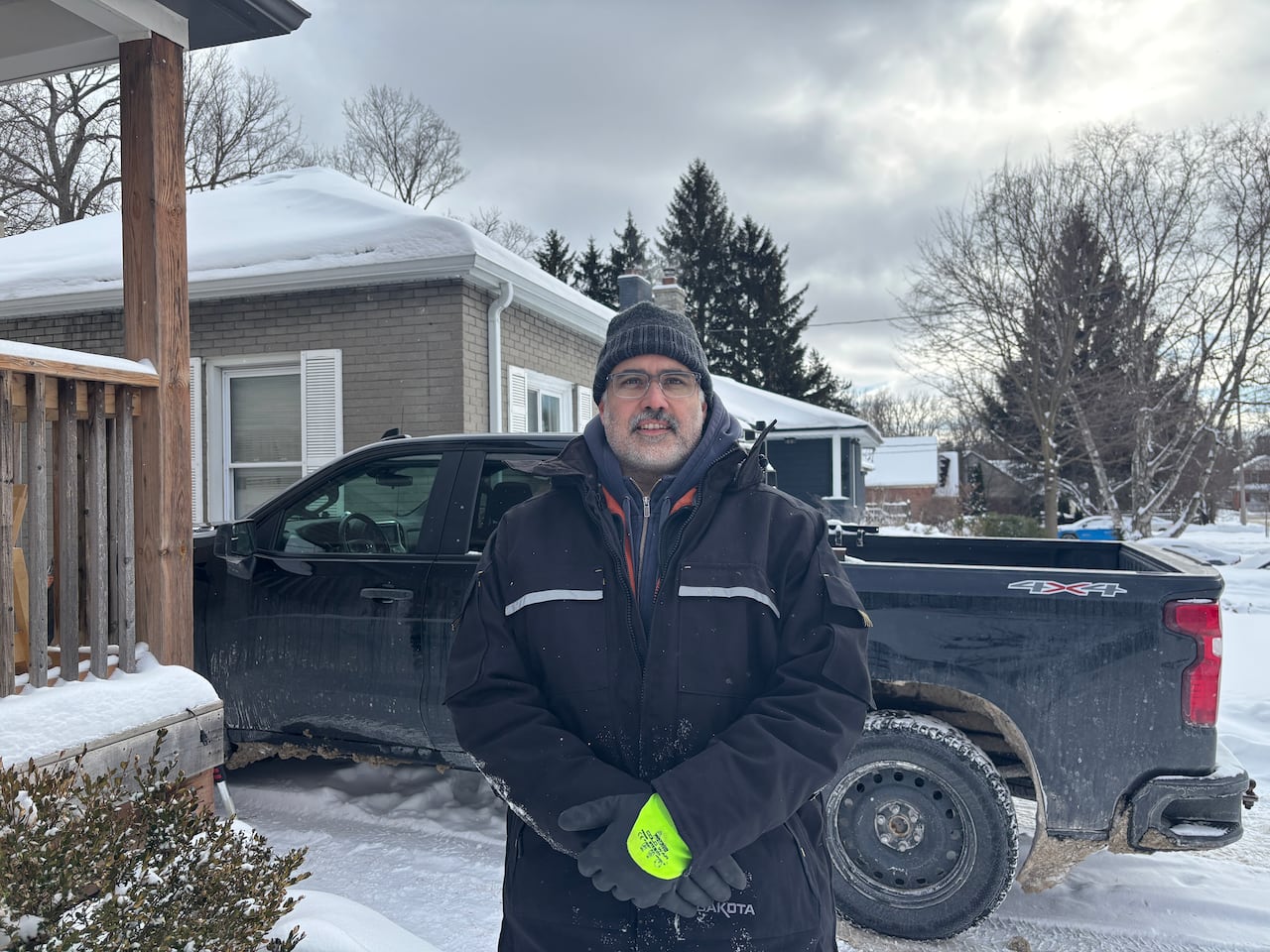 Portrait of sculptor Graham Henning standing outdoors.