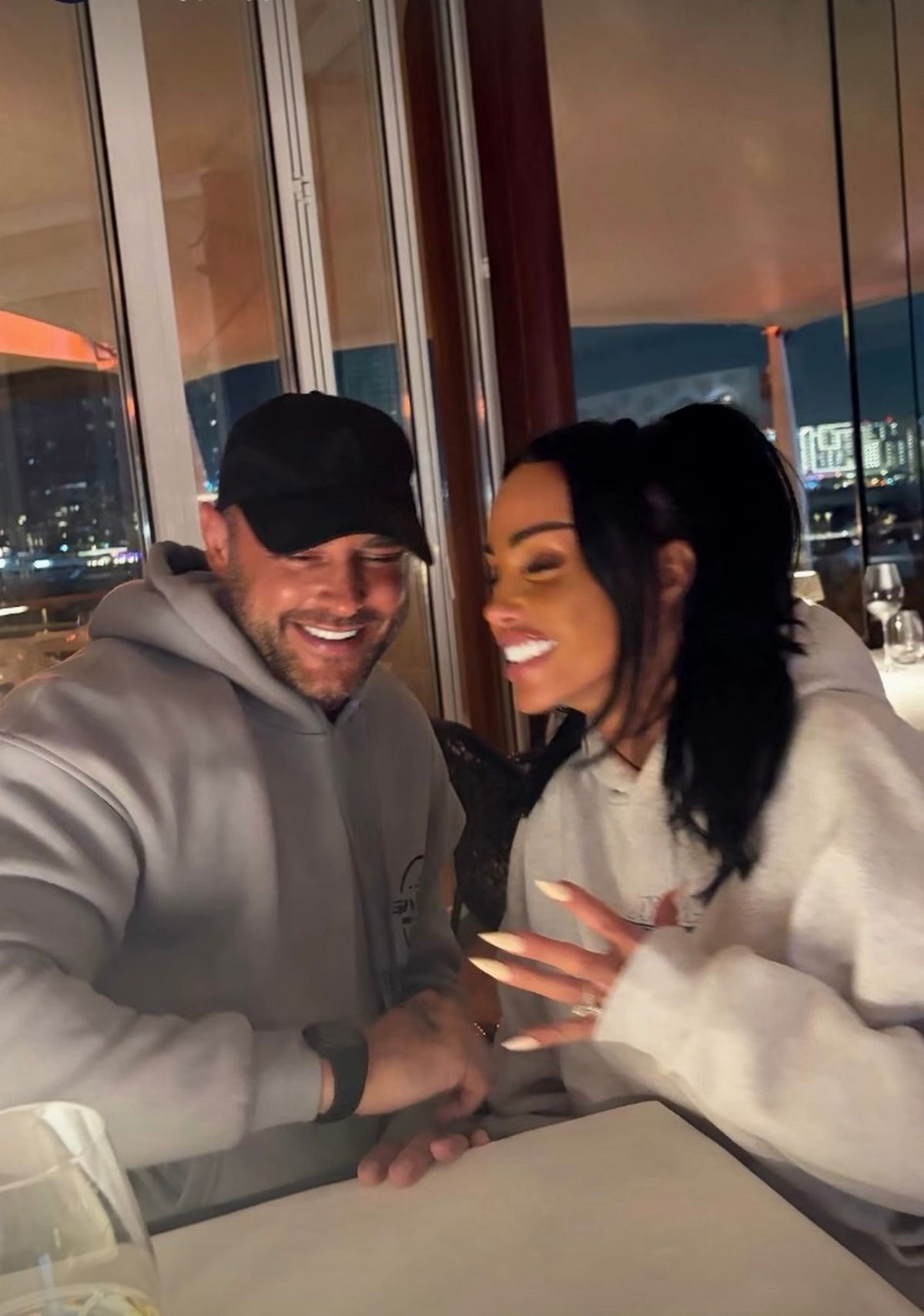 katie price and new husband lee in smiling photo at bar