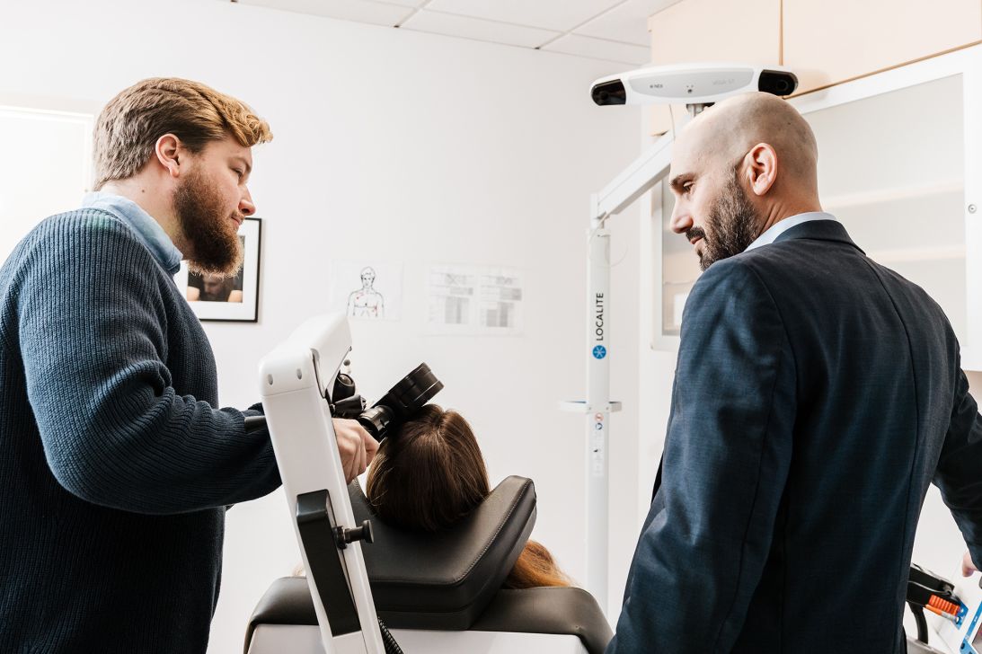 (From left) Dr. Christopher Austelle, anonymous patient Willow and Dr. Ian Kratter in the Brain Stimulation Lab treatment room.