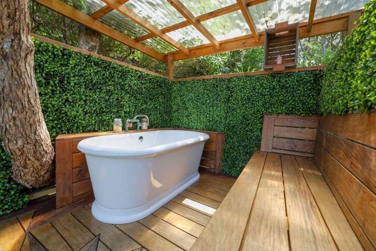 A canvas bach at 403 Shoal Bay Road, on Great Barrier Island, is heading to auction. Photo / Supplied