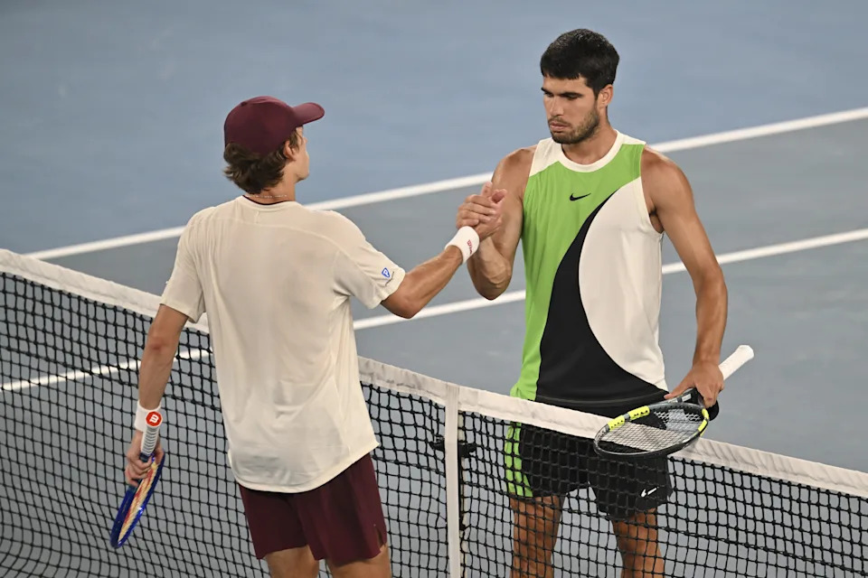 Pictured right to left, Carlos Alcaraz and Alex de Minaur in their Australian Open quarter-final. 